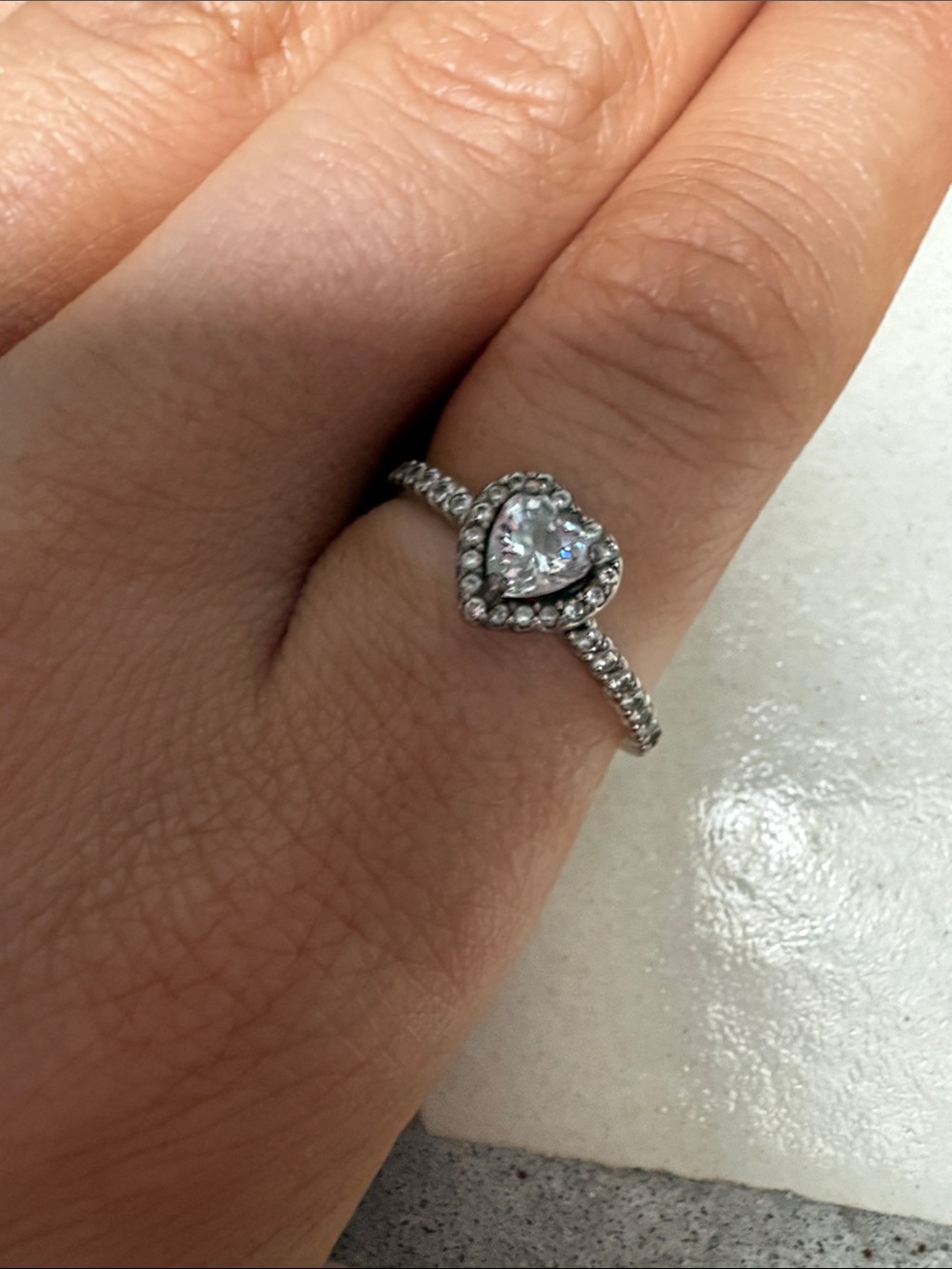 Silver elevated heart ring from pandora. (Missing 2 stones, hardly noticeable)
